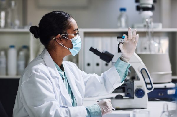 Cropped shot of a young female scientist examining a medical sample inside of a vile while working in her laboratory