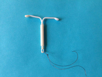 A T-shaped white IUD