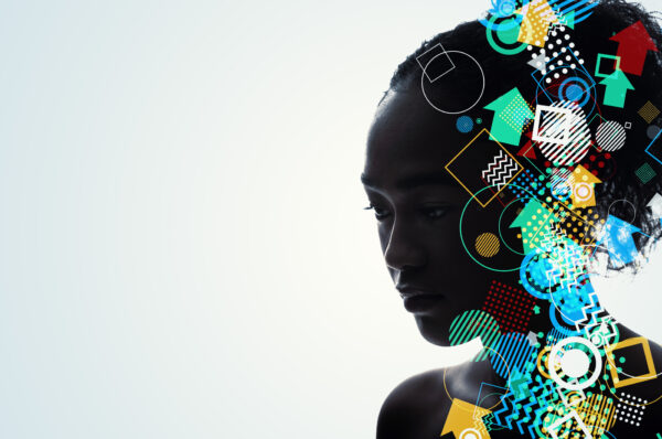 a woman's silhouette with colorful shapes across her face. She appears in thought and the concept is modern art-like