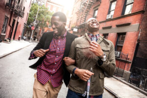 Young men walking and laughing