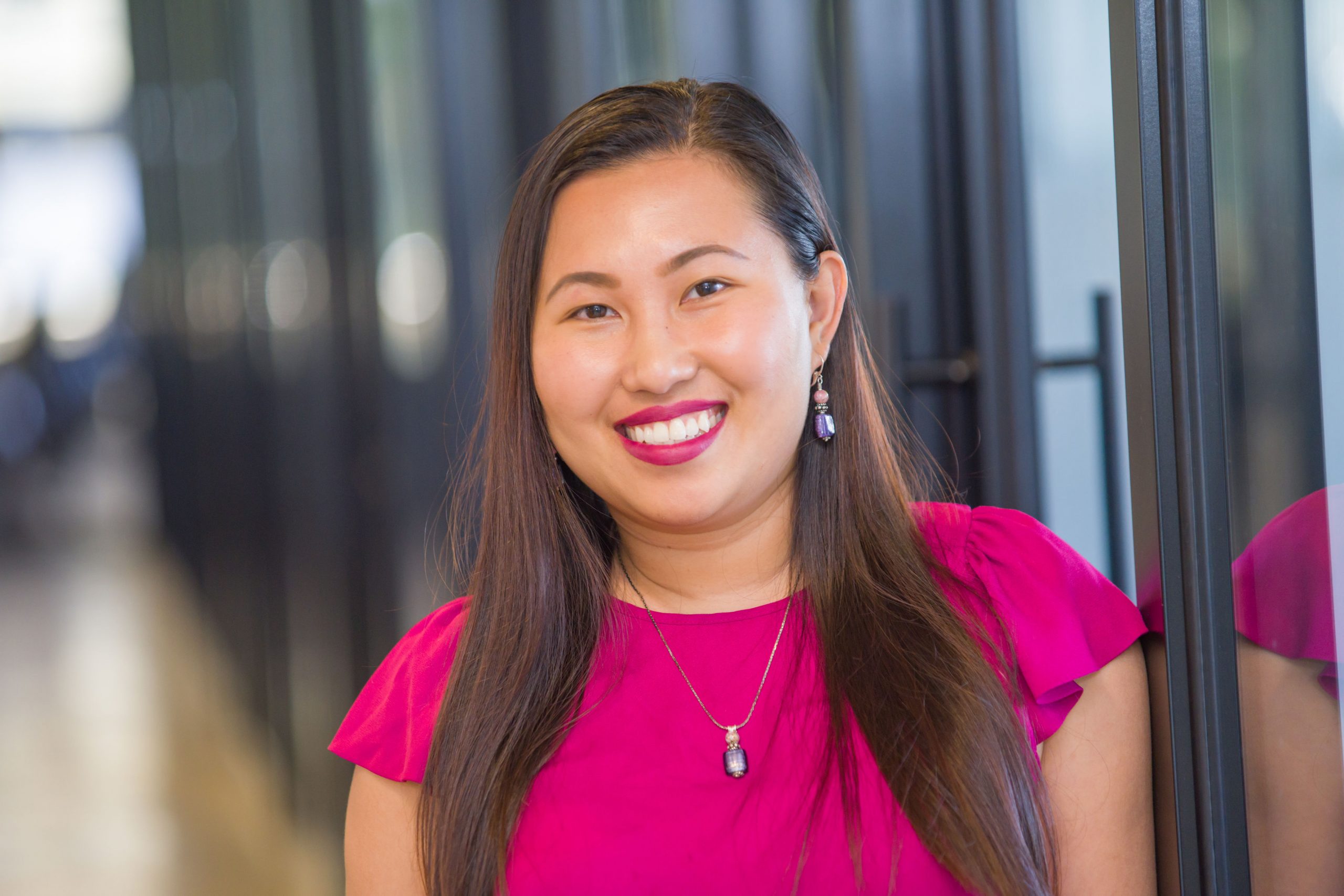 CAPTC Family Pact program manager Nicole Nguyen smiling in an office hallway