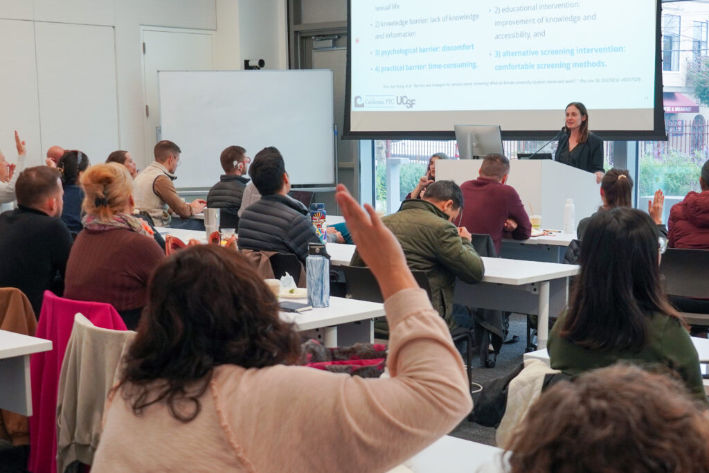 Live lecture at the STI Intensive with participants raising hands
